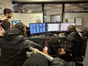  674ece39523ca 674ece39523ccbowie With C2c Train Announcer Paul Thomas At Fenchurch Street Station Looking At The Screens.jpg